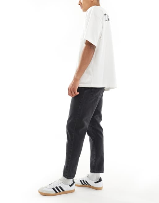 ASOS DESIGN tapered jeans in washed black 