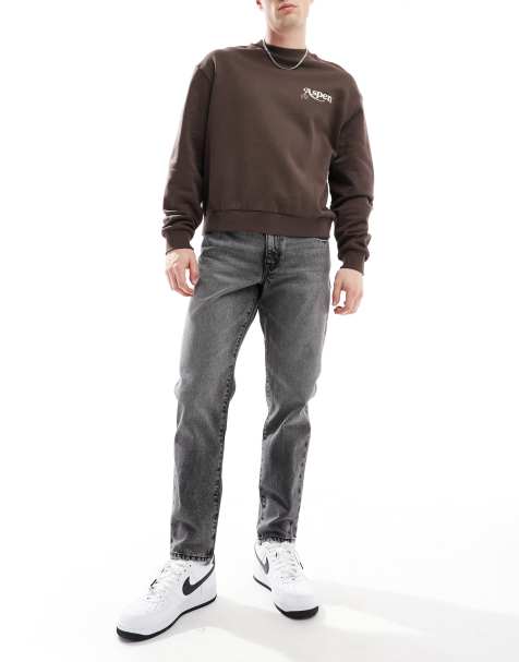 ASOS DESIGN tapered jeans in washed black - view 1