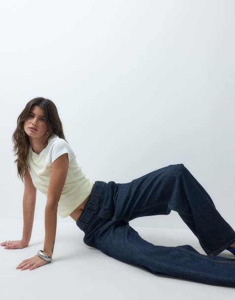 ASOS DESIGN tapered jeans med betrukket knap i rinse - view 1