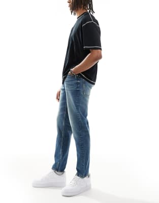 Asos Design Tapered Jeans With Tint