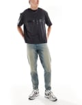 [ASOS DESIGN] ASOS DESIGN tapered jeans with tint in light wash blue W29 L32 LIGHT WASH BLUE