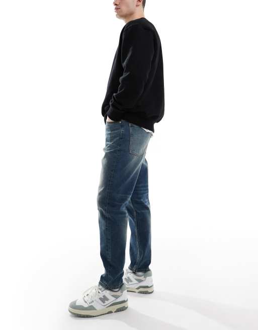 ASOS DESIGN tapered jeans with vintage tint in dark wash blue, 2 of 5