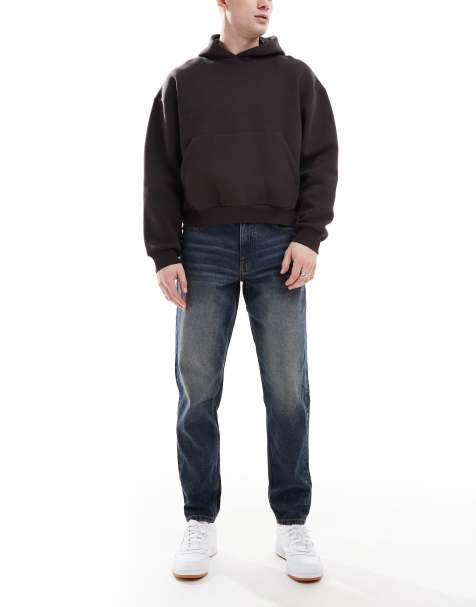 ASOS DESIGN tapered jeans with vintage tint in dark wash blue - view 1