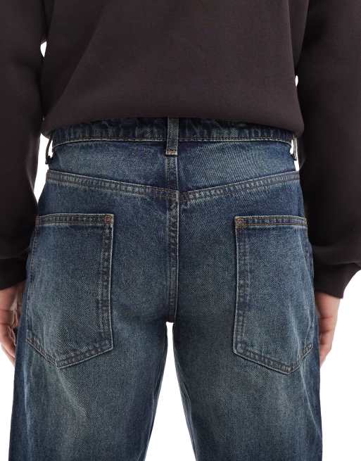 ASOS DESIGN tapered jeans with vintage tint in dark wash blue