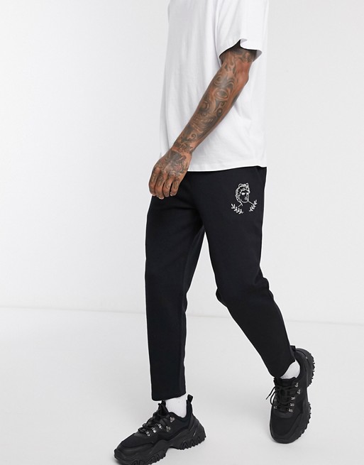 ASOS DESIGN tapered jogger with placement print in black