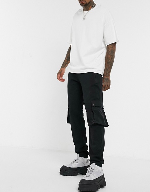 ASOS DESIGN tapered joggers in black with nylon pockets in black