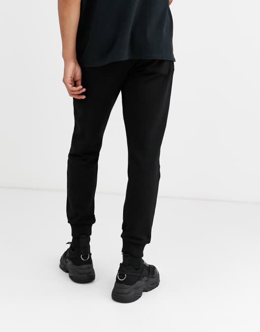 ASOS DESIGN tapered joggers in black