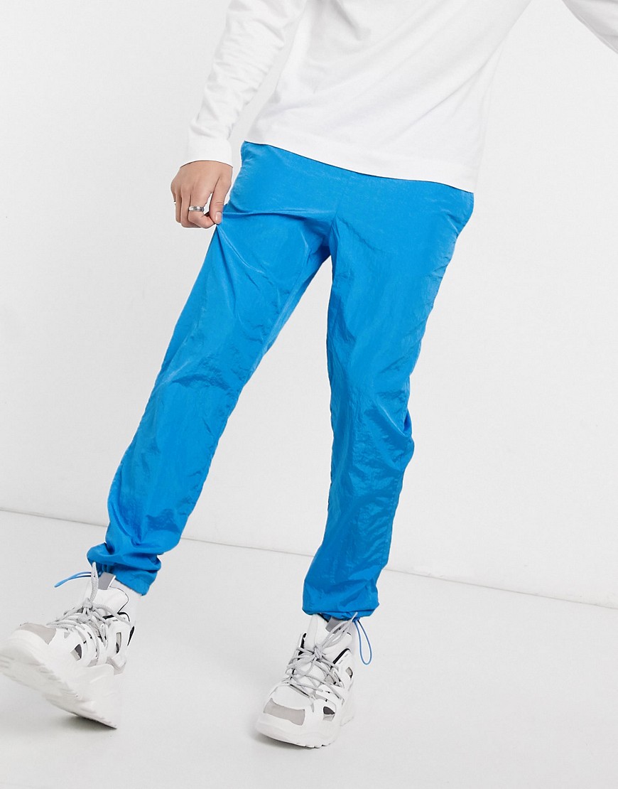 ASOS DESIGN tapered joggers in blue nylon