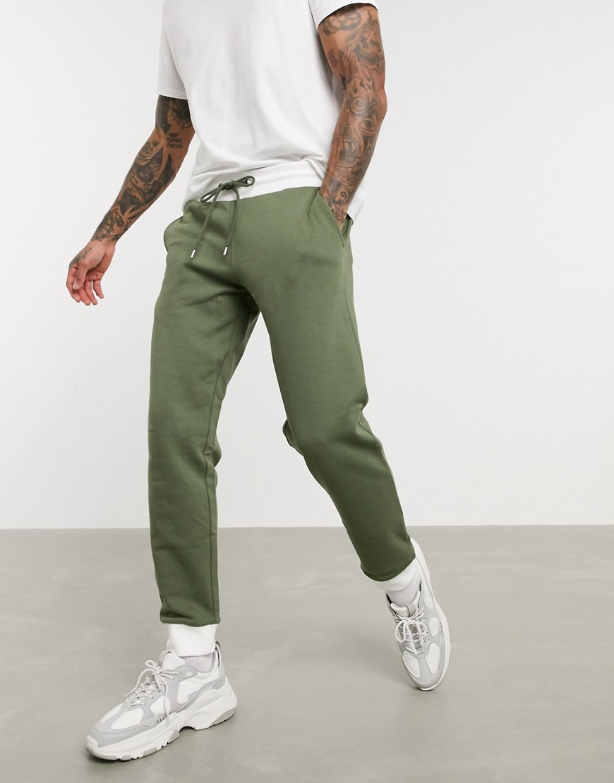 ASOS DESIGN tapered joggers in khaki with off white rib-Green