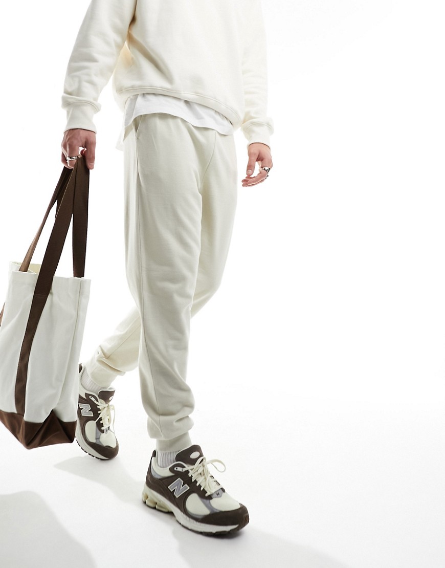 ASOS DESIGN tapered joggers in light beige-Neutral