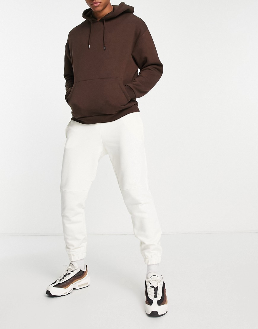 ASOS DESIGN tapered joggers in off white-Neutral