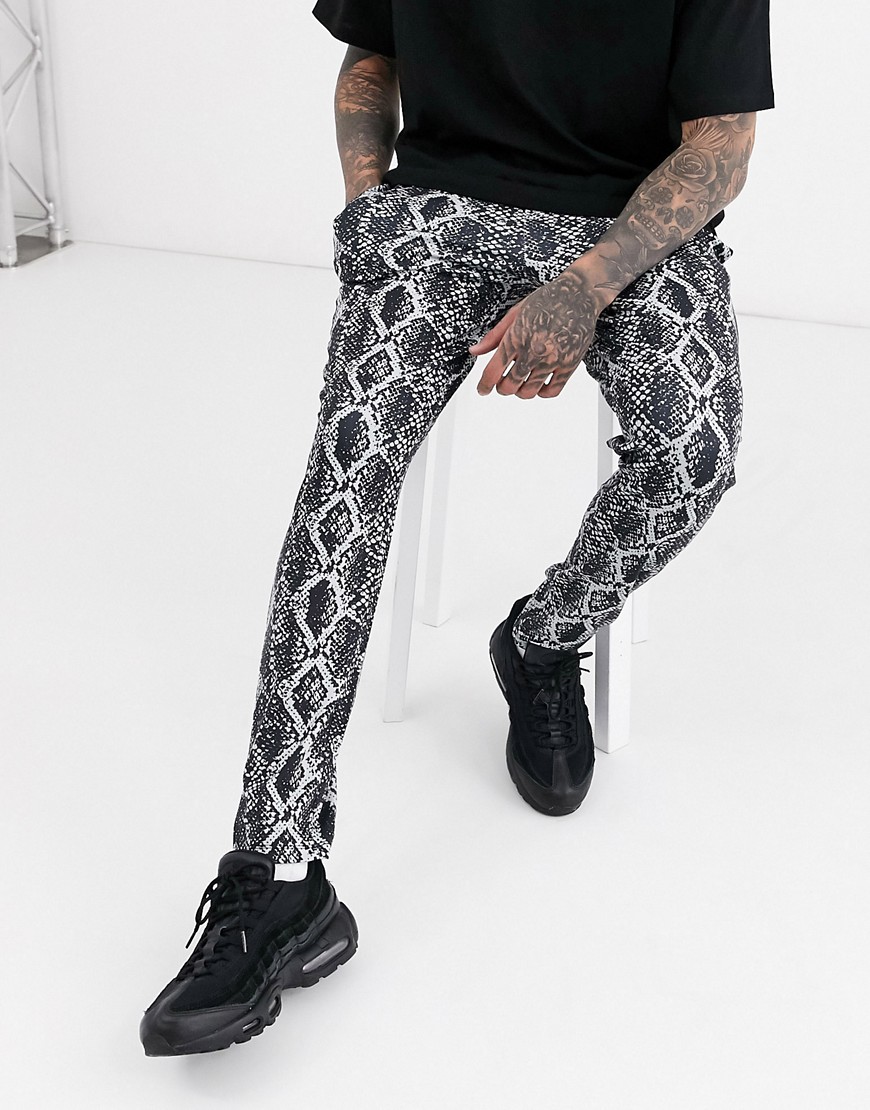 ASOS DESIGN tapered joggers in snake look with black contrast waistband and cuff