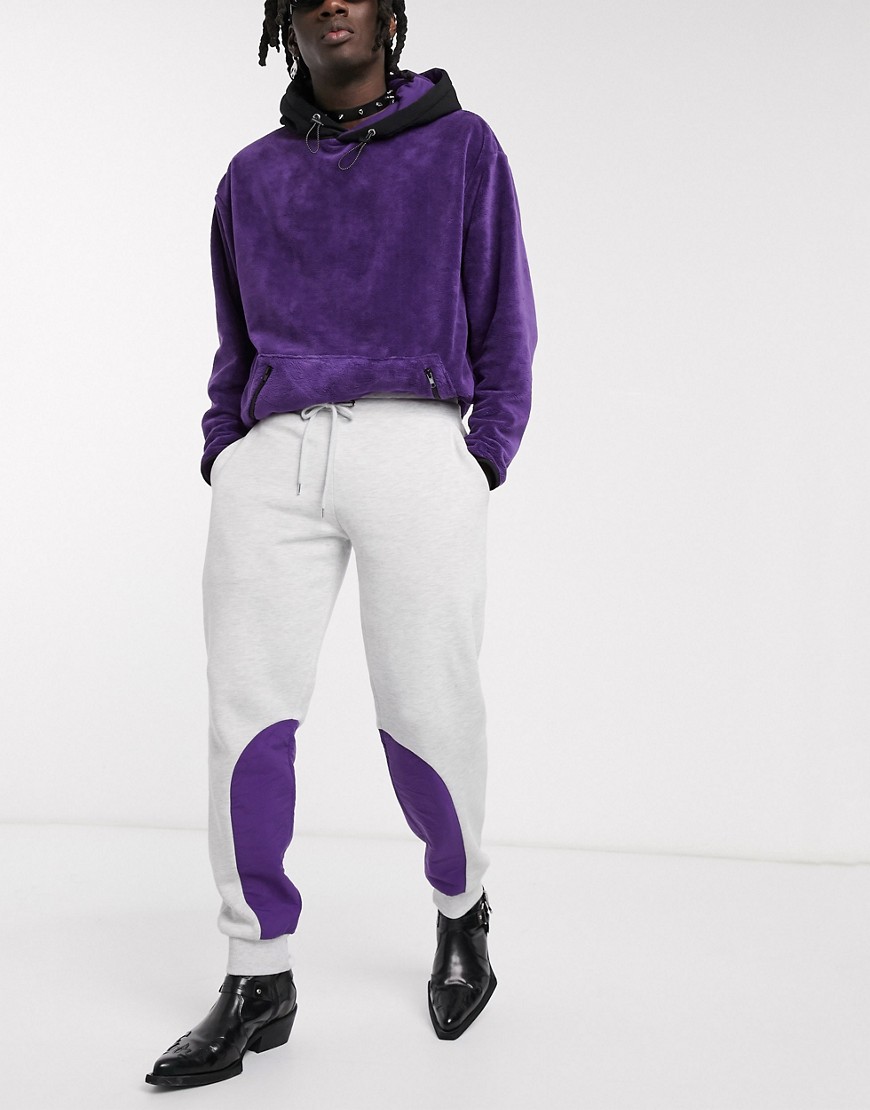 ASOS DESIGN tapered joggers in white marl with purple nylon panels
