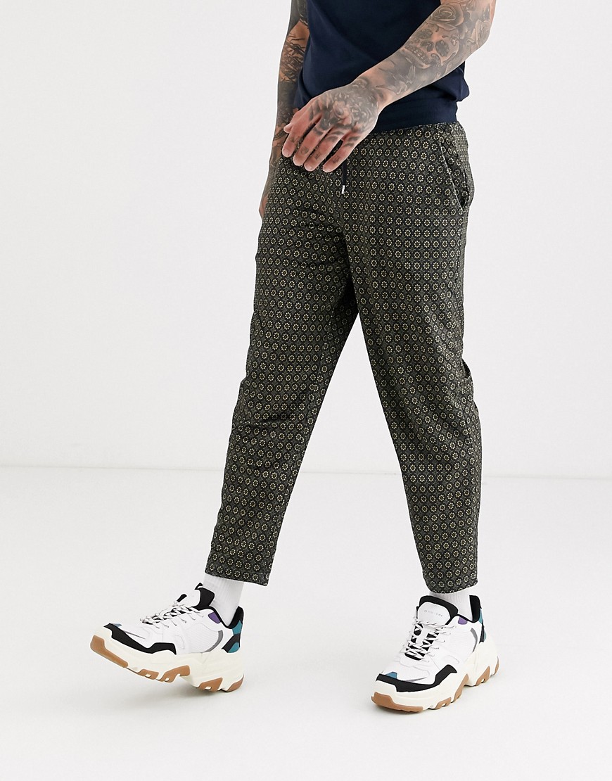 ASOS DESIGN tapered joggers with all over print-Brown
