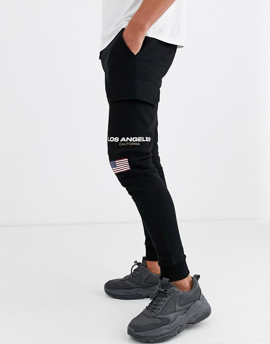 ASOS DESIGN tapered joggers with los angeles print with cargo pocket-Black