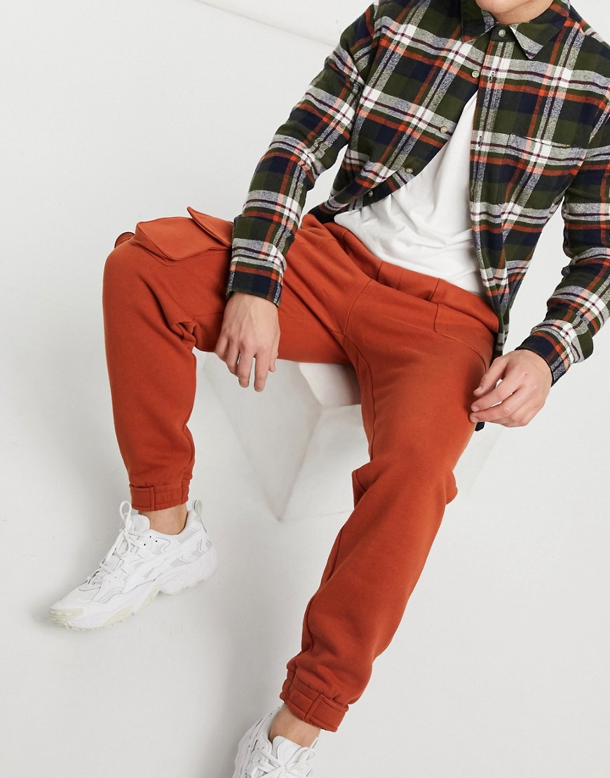 ASOS DESIGN tapered joggers with multi utility pockets & tab cuffs in burnt red-Brown