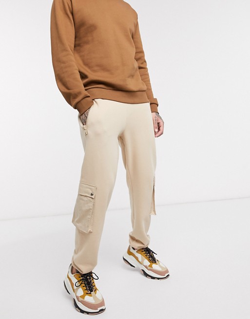 ASOS DESIGN tapered joggers with nylon pockets in beige
