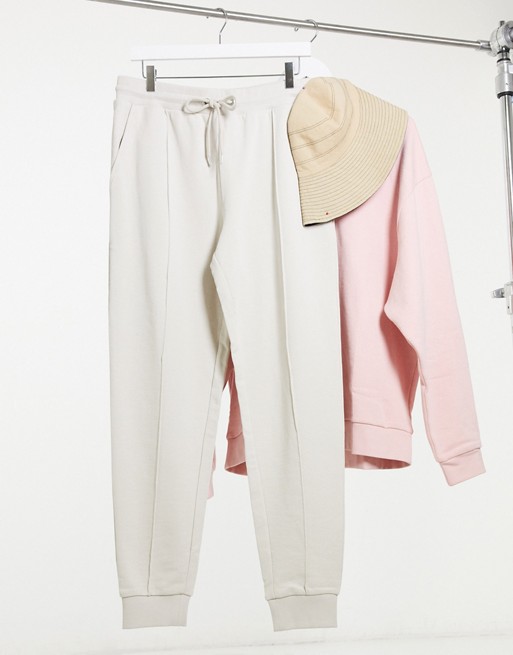 ASOS DESIGN tapered joggers with pin tuck in beige