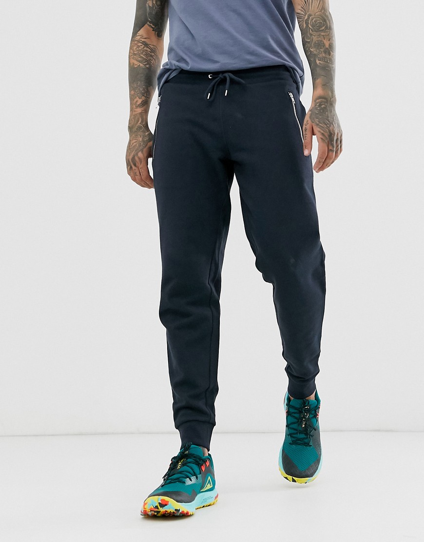 ASOS DESIGN tapered joggers with silver zips in navy