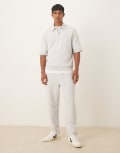 [ASOS DESIGN] ASOS DESIGN tapered loopback trackies with side piping in grey marl M Grey marle