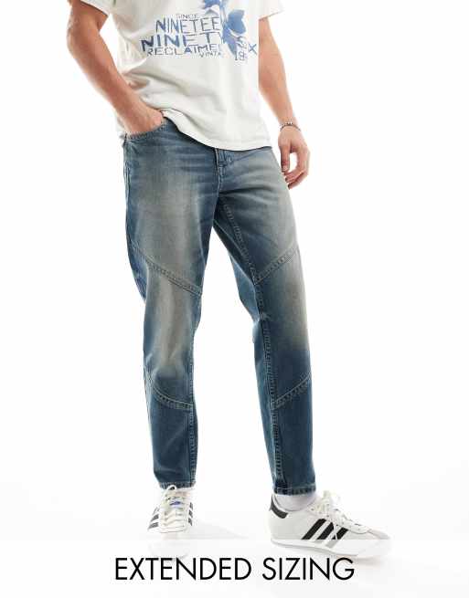 ASOS DESIGN - Tapered mørkeblå jeans med paneler og vintage-toning