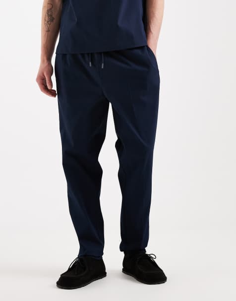 ASOS DESIGN tapered pants in navy - view 1