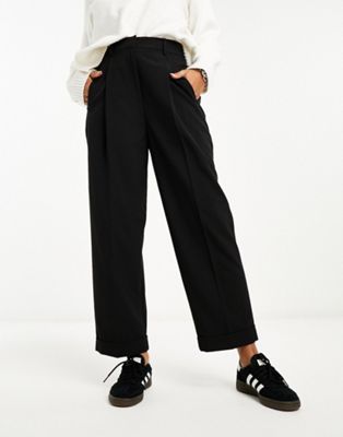 Shop Asos Design Tapered Pants With Turn Up Hem In Black