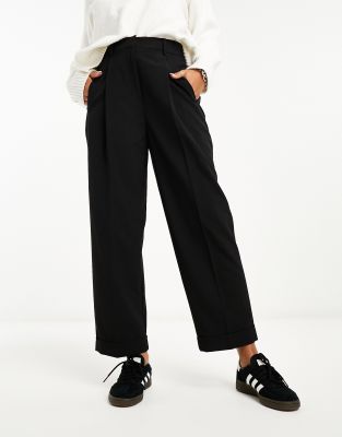 ASOS DESIGN tapered pants with turn up hem in black | ASOS