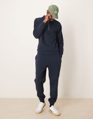 ASOS DESIGN tapered pin tuck sweatpants in navy - part of a set - view 1