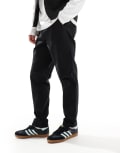 [ASOS DESIGN] ASOS DESIGN tapered pull on pants with back pocket patch in black XS BLACK