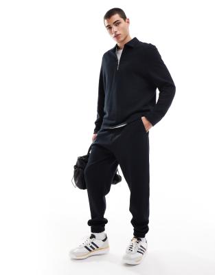 ASOS DESIGN tapered rib sweatpants in black
