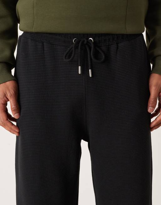 ASOS DESIGN tapered ribbed trackies in black (Part of a set), 4 of 5