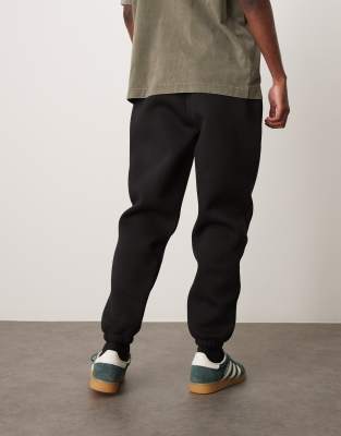 ASOS DESIGN tapered scuba trackies in black