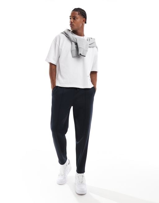 ASOS DESIGN tapered scuba trackies in navy