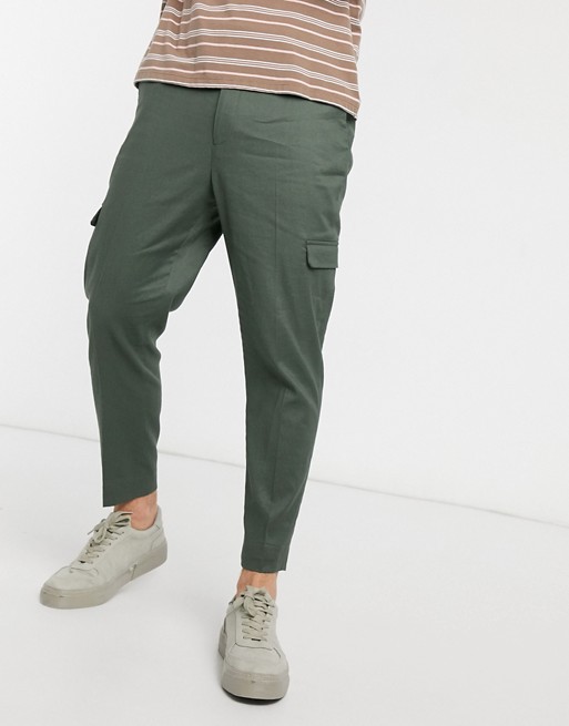 ASOS DESIGN tapered smart trousers in green linen and cargo pockets