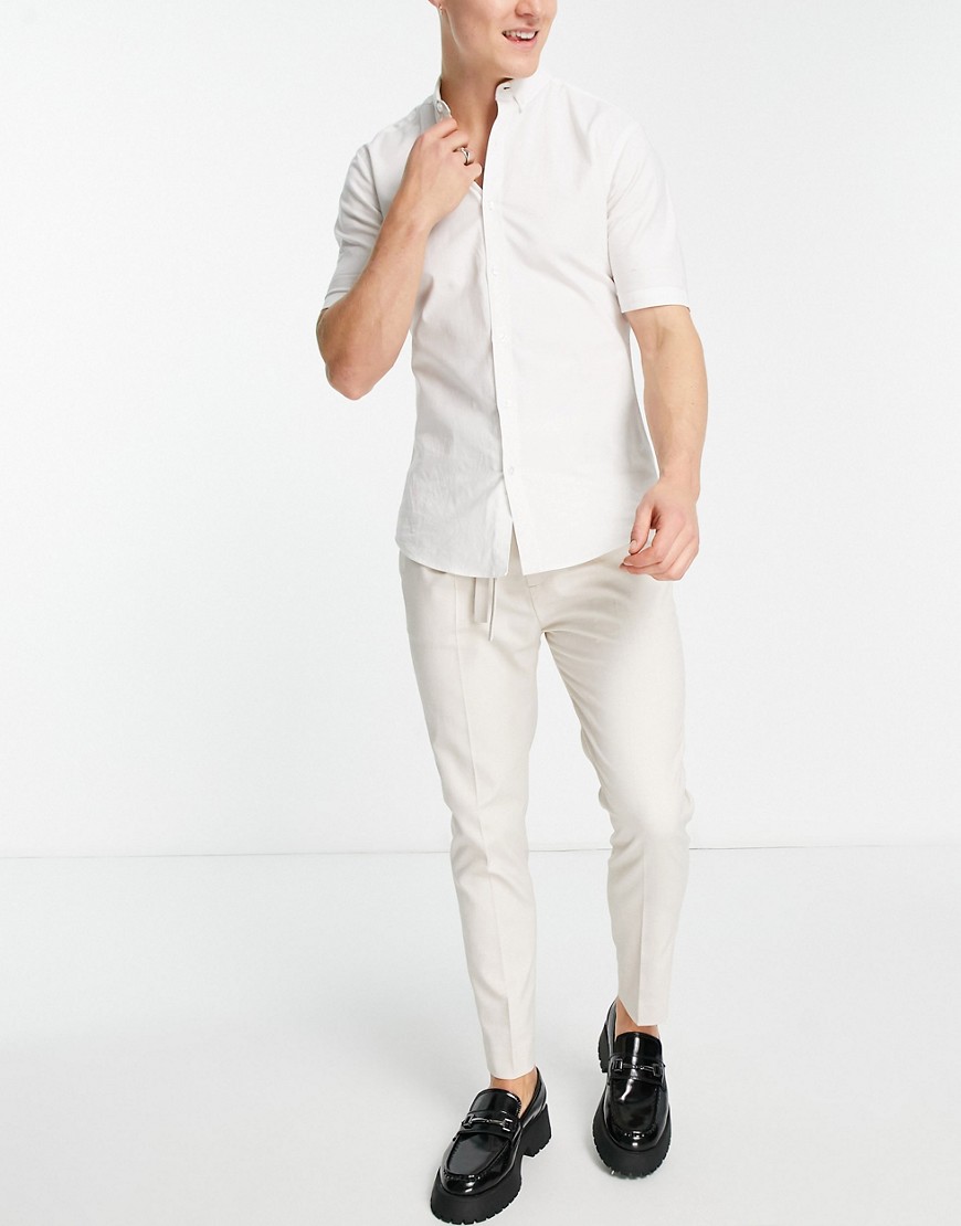 ASOS DESIGN tapered smart trousers with double buckle in ecru-White