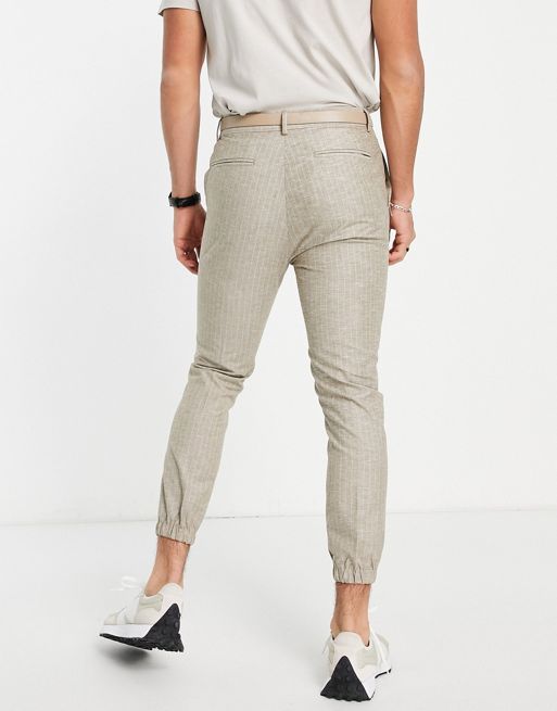 ASOS DESIGN tapered suit pants with sweatpants waist and turn up in khaki  green cotton