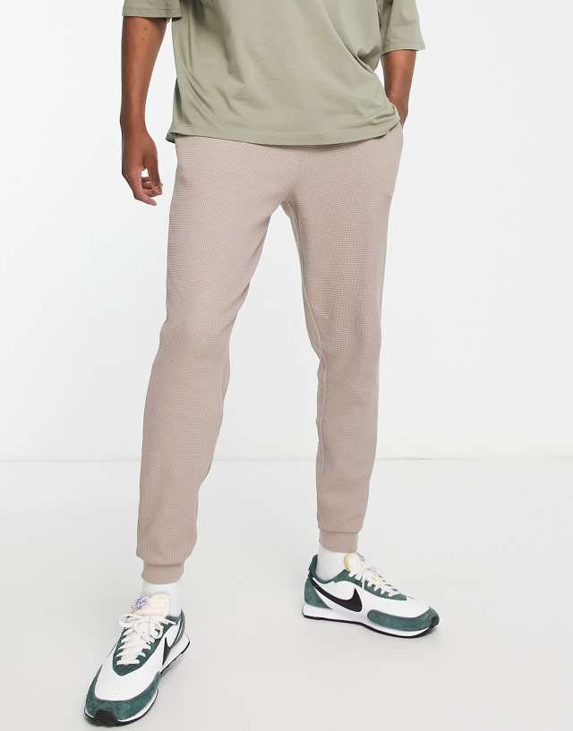 ASOS DESIGN tapered sweatpants in beige waffle