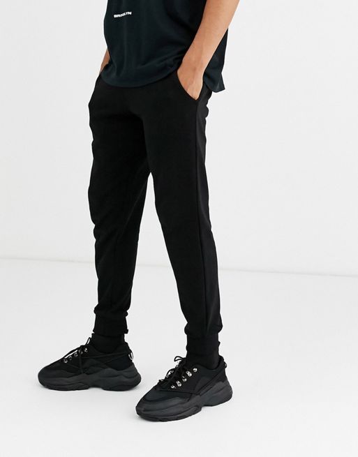 ASOS DESIGN tapered sweatpants in black | ASOS