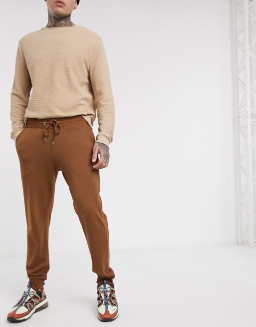 ASOS DESIGN tapered sweatpants in brown | ASOS