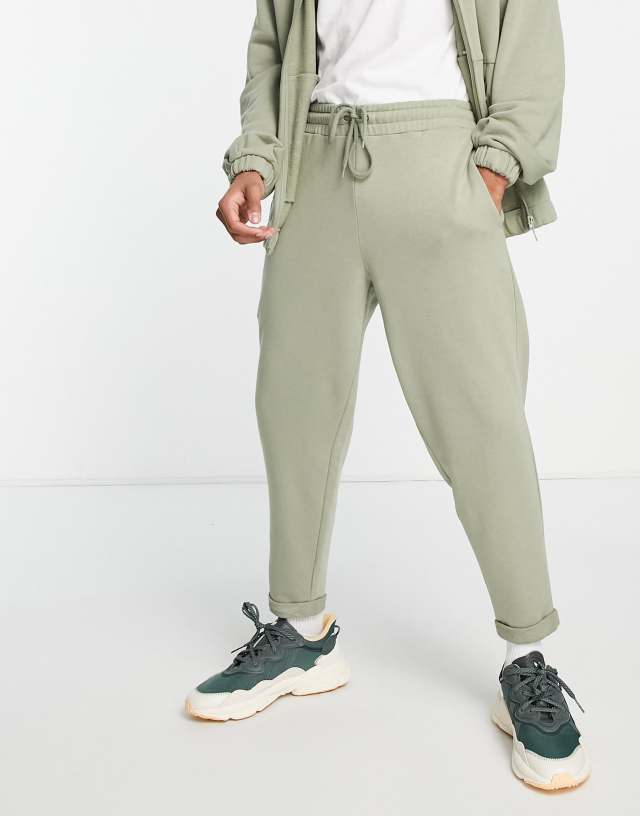 ASOS DESIGN tapered sweatpants in green - part of a set