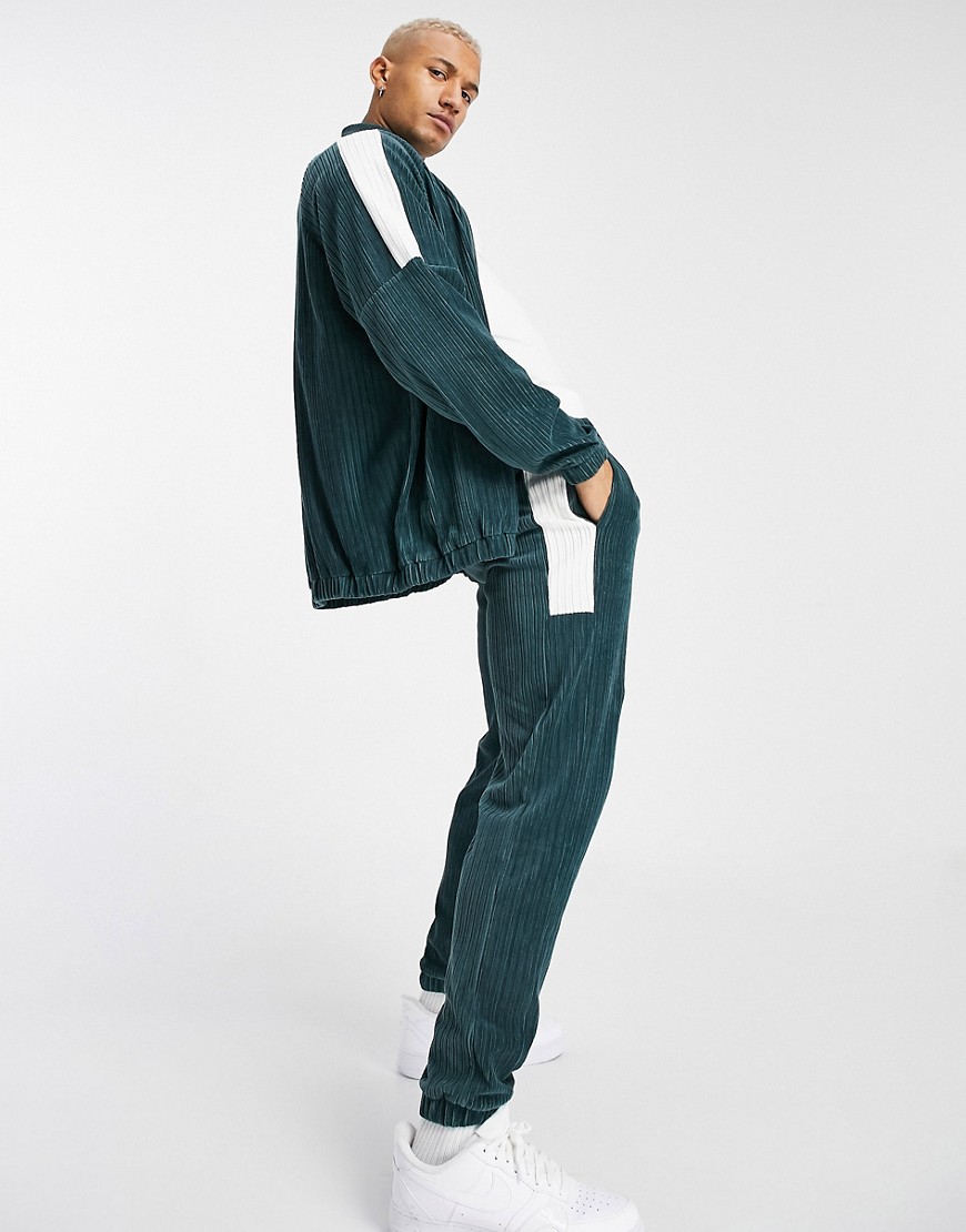 ASOS DESIGN tapered sweatpants in velour corduroy with color blocking-Green