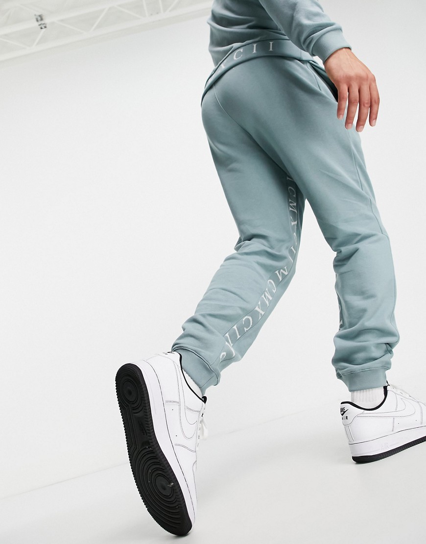 ASOS DESIGN tapered sweatpants with Roman numerals inside tape in blue gray - part of a set-Grey