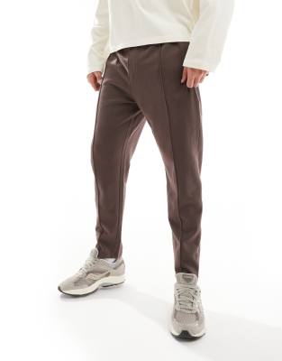 tapered sweatpants with zip closure in brown