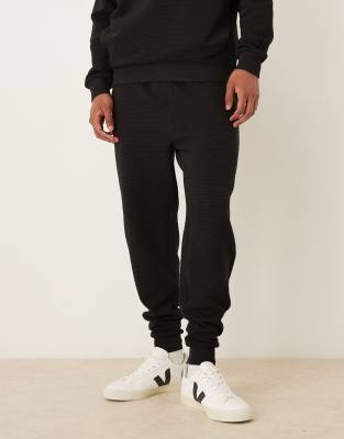ASOS DESIGN tapered trackies with ribbed cuff in black (Part of a set ...
