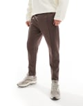 [ASOS DESIGN] ASOS DESIGN tapered trackies with zip fastening in brown M Seal brown