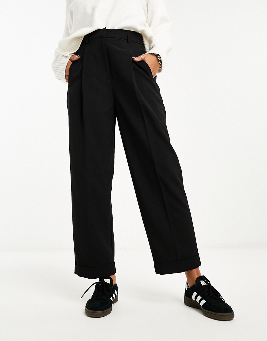 ASOS DESIGN tapered trouser with turn up hem in black