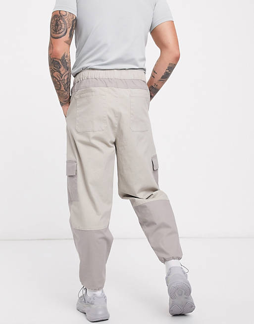 ASOS DESIGN tapered trousers in cut and sew colour blocking