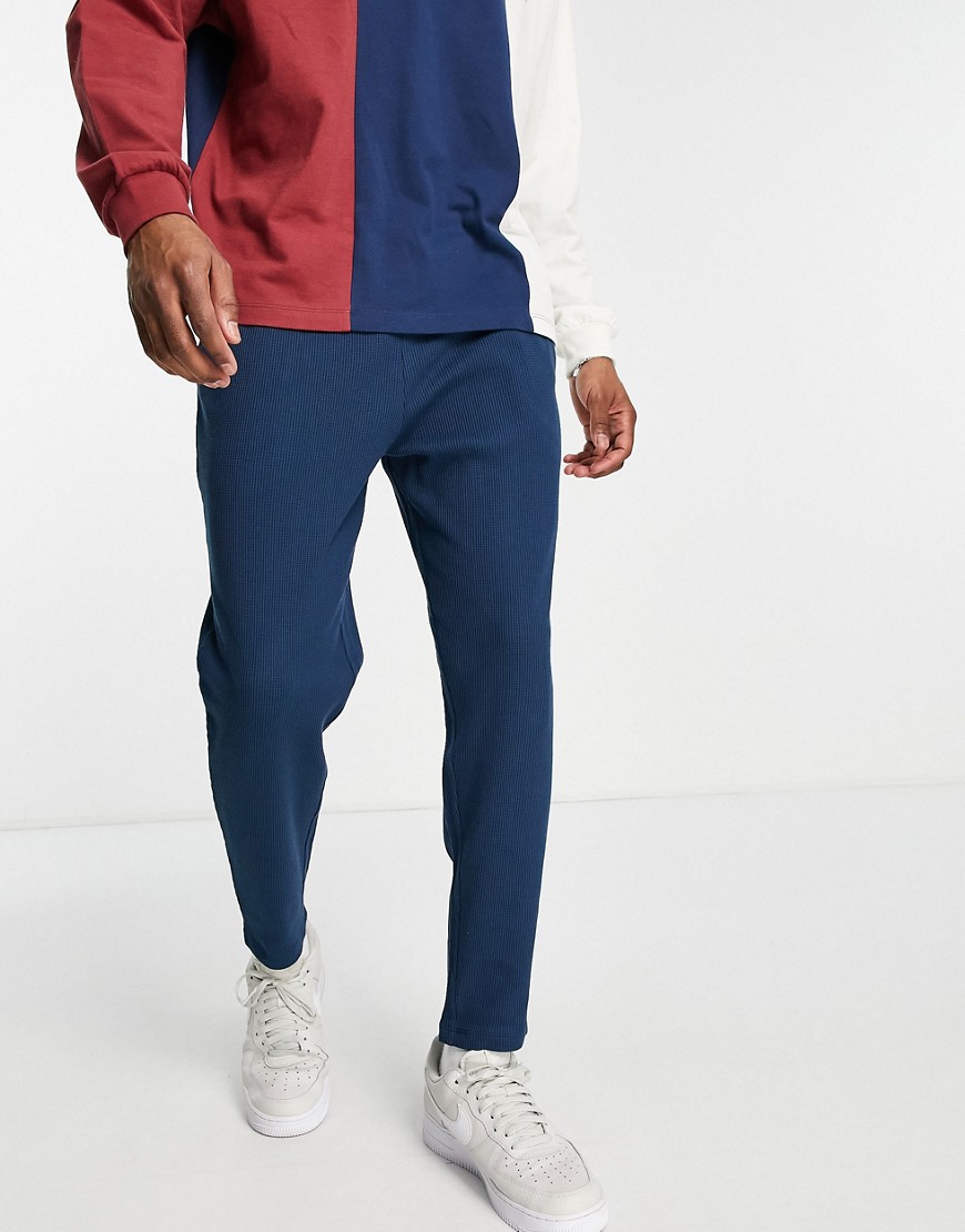 ASOS DESIGN tapered waffle sweatpants with fixed hem in navy - part of a set