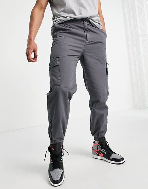 ASOS DESIGN tapered washed cargo trousers in dark shadow